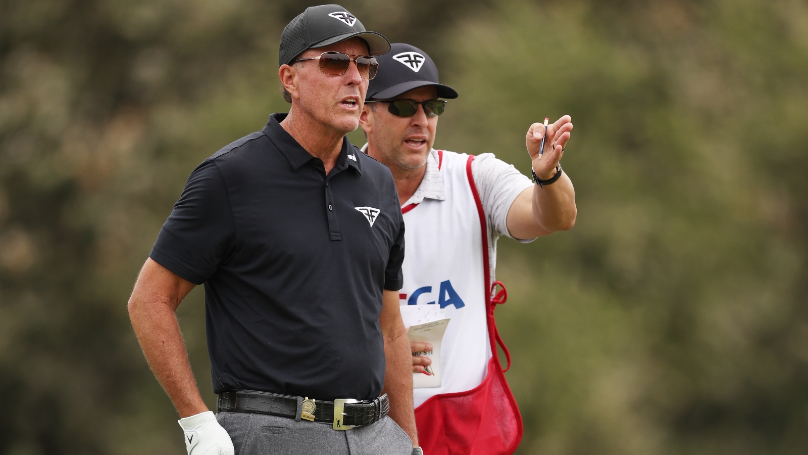 Phil Mickelson and his brother Tim as a caddie
