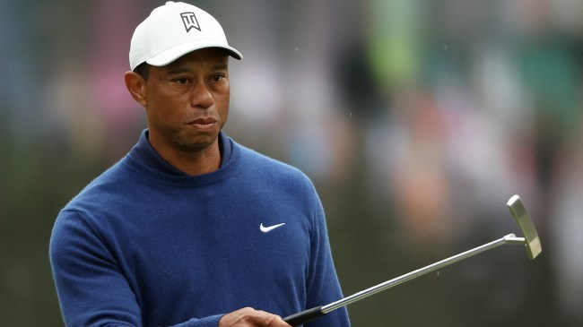 Tiger Woods holding a putter