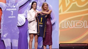 Caitlin Clark at the WNBA Draft after being selected with the first pick.