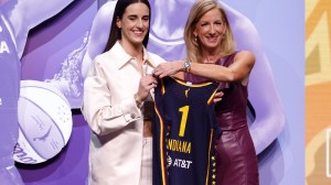 Caitlin Clark at the WNBA Draft after being selected first overall.
