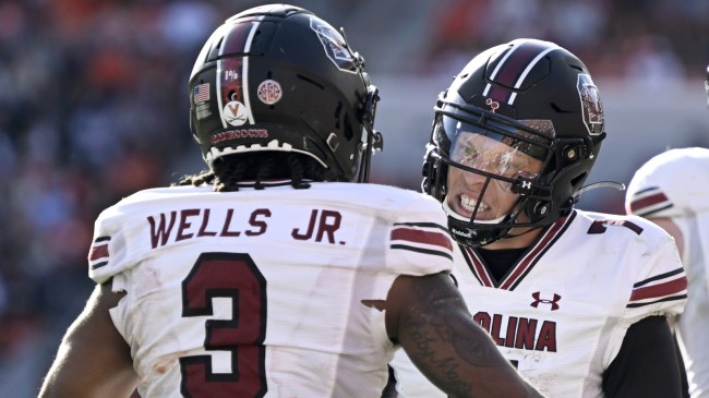 South Carolina's Juice Wells and Spencer Rattler celebrate after a play.
