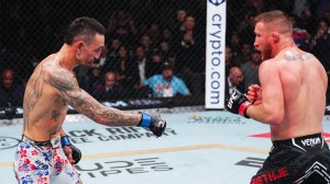 Max Holloway gestures at Justin Gaethje in the BMF championship