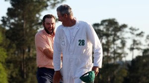 Scottie Scheffler and Ted Scott celebrate after winning at The Masters.