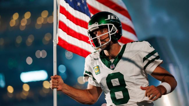 aaron rodgers carrying the american flag