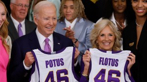 Joe and Jill Biden holding LSU basketball jerseys