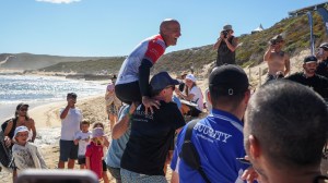 Kelly Slater being carried off Margaret River Pro event in Australia