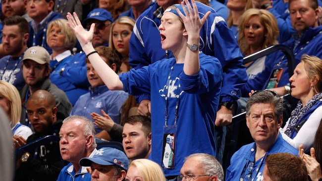 Kentucky basketball fans react to a call on the court.