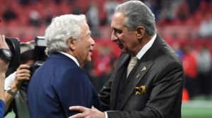 nfl owners robert kraft and arthur blank embracing on the field