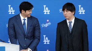 Shohei Ohtani and interpreter Ippei Mizuhara are introduced with the Los Angeles Dodgers.