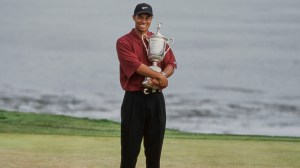 Tiger Woods holding the 2000 US Open trophy at Pebble Beach