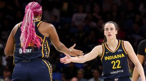 Caitlin Clark of the Indiana Fever high-fives Aliyah Boston