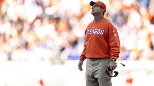 Dabo Swinney looks at the scoreboard during a bowl game between Clemson and Kentucky.