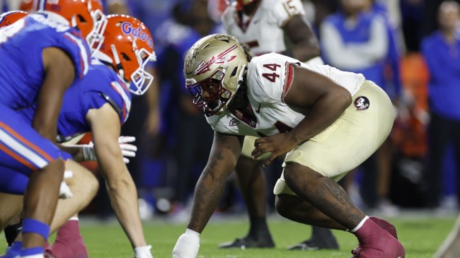 A view of the line of scrimmage during a football game between the Florida Gators and Florida State Seminoles.