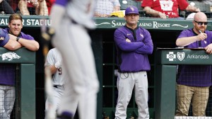 LSU baseball coach Jay Johnson watches from the dugout.