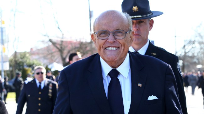 Rudy Giuliani arrive at the funeral of NYPD officer