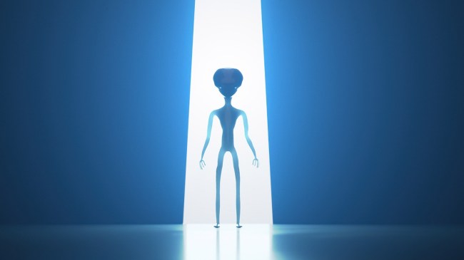 Silhouette of alien in light beam