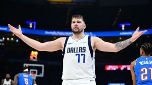 luka doncic holding his arms up