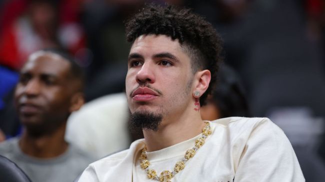 nba player lamelo ball sitting courtside