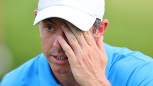 Rory McIlroy rubbing his eye