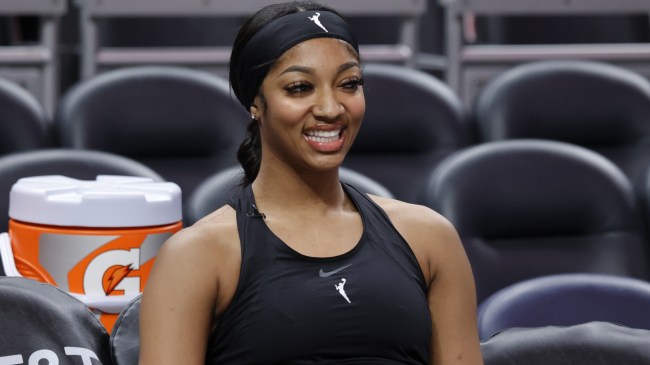 Angel Reese on the bench during a Chicago Sky warm-up.