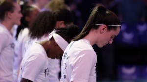 Caitlin Clark joins Indiana Fever players for the national anthem before a game.