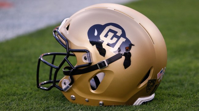 A Colorado football helmet on the sidelines.