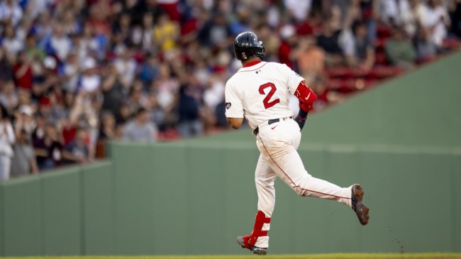 Dominic Smith of the Boston Red Sox rounds the bases after hitting a HR.