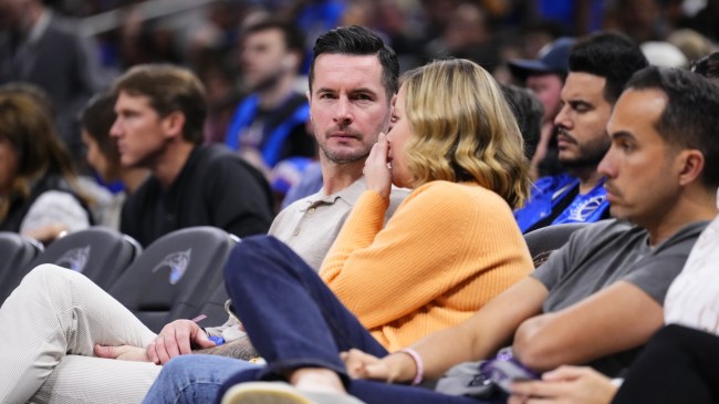 JJ Redick sits courtside at an NBA game.