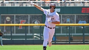 Texas A&M outfielder Jace LaViolette rounds the bases after hitting a home run.