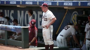 Texas A&M baseball coach Jim Schlossnagle stands in the dugout at the SEC Tournament.