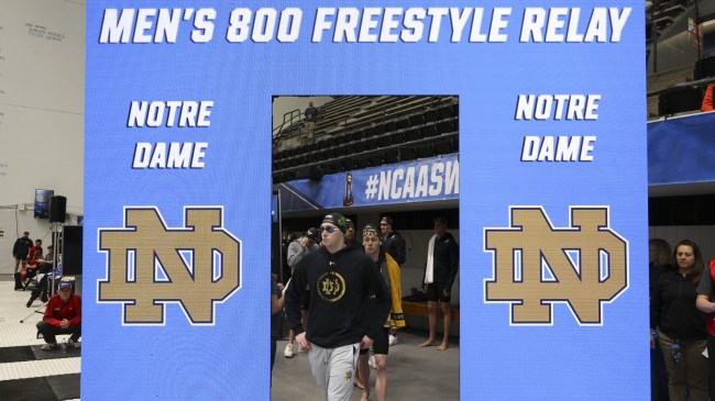 Notre Dame swimmers enter an event.
