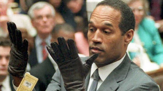 OJ Simpson tries on a new pair of Aris extra-large gloves in court