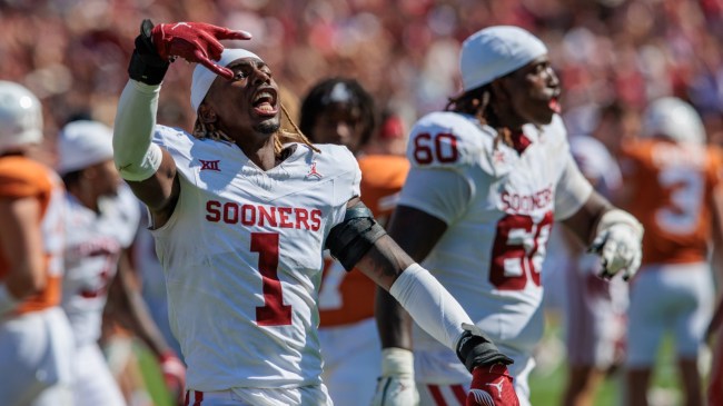 An Oklahoma player flashes a 'Horns Down' sign after beating Texas.