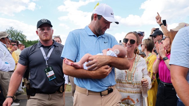 Scottie Scheffler holds his son, Bennett, after winning the Memorial Tournament.