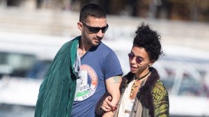 Shia LaBeouf and FKA Twigs walking by the Seine river