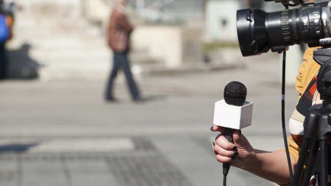 A reporter preps for an interview.