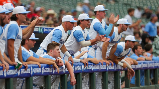 UNC baseball players celebrate in the dugout.