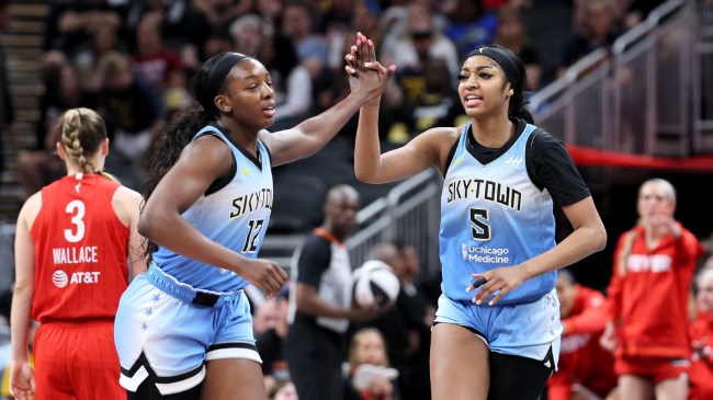 Angel Reese celebrates with a Chicago Sky teammate after a play.