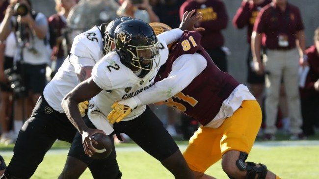 Colorado QB Shedeur Sanders is sacked during a football game against Arizona State.