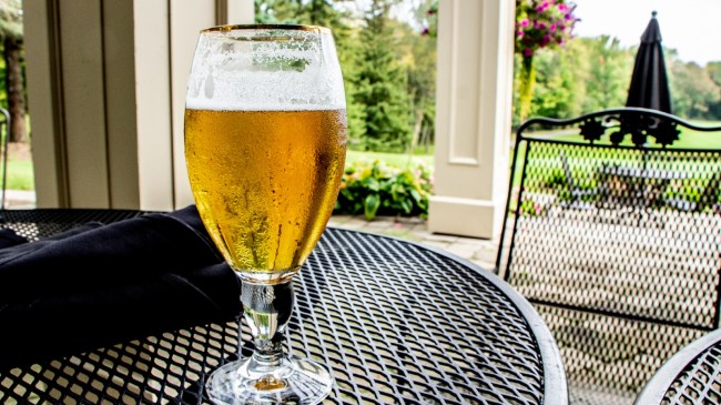 A beer on a table at a golf club.