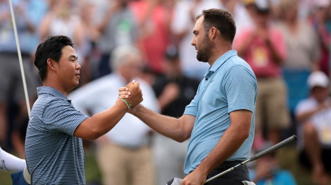 Scottie Scheffler shakes Tom Kim's hand after beating him at the Travelers Championship.
