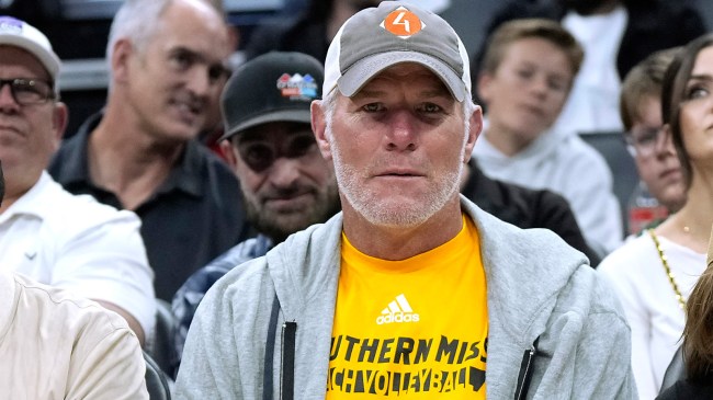 Brett Favre sits courtside NBA basketball game Milwaukee Bucks