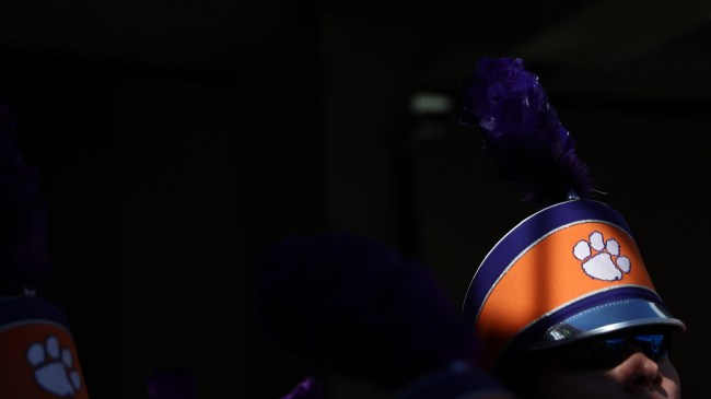 A Clemson Tigers logo on a marching band member's hat.