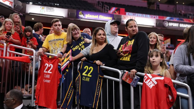 Fans of WNBA guard Caitlin Clark wait by the entrance to the court