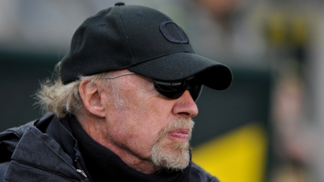 Nike co-founder Phil Knight on the field before a football game between Oregon and Arizona.