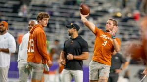 Arch Manning and Quinn Ewers warm up for the Texas Longhorns.