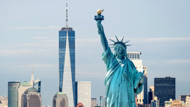 Statue Liberty with background of Manhattan