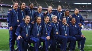 Team USA women's rugby poses with their bronze medals.