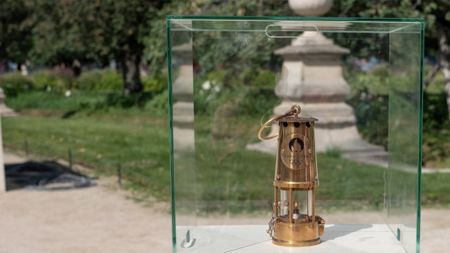 The Olympic flame lantern under glass in the Tuileries Garden