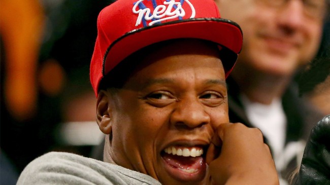 Jay Z wearing a Brooklyn Nets hat
